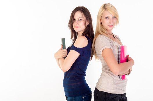 Two beautiful student girls against white background