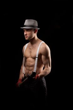 men in the hat on with suspenders over black