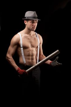 men in the hat on with suspenders over black