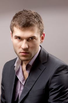 portrait of young man over gray background