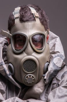 Man in protective suit against dark background