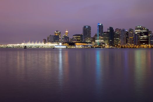 Vancouver BC City Skyline and Stanley Park along Burrard Inlet at Break of Dawn