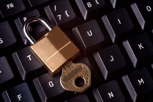 A padlock on top a computer keyboard to represent the concept of computer security
