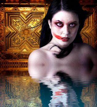 Woman vampire with blood in his mouth. Gothic Image halloween over gold background in the water reflection