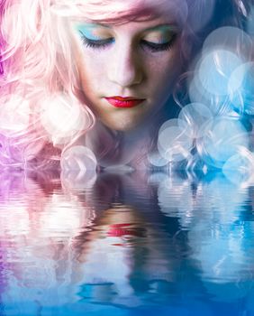 Sweet teen with colored hair, light effects in the water reflection