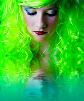 green fairy girl head down with reflection in water