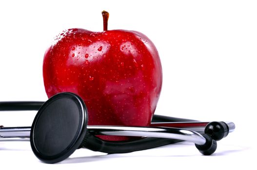 Apple and Stethoscope. Conceptual image to illustrate healthy eating, healthcare, diet, nutrition.