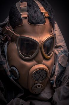 Man in protective suit against dark background