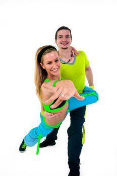 Acrobatic dancing with two young trainers on white background