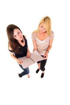 Two beautiful student girls getting ready for school isolated