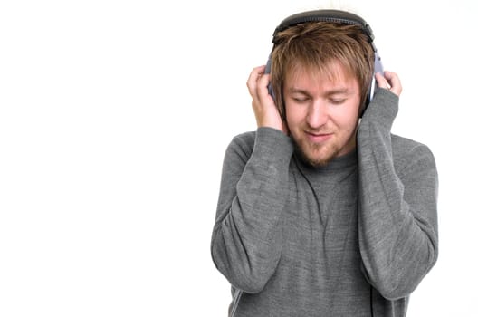 Young man with headphones against white background