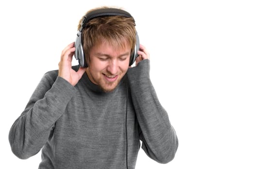 Young man with headphones against white background