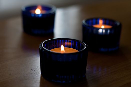 Closeup dof shot of a three blue candles