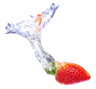 Strawberry dropped on a water tank with a splash of water behind it