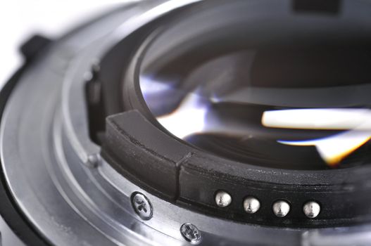 Closeup of a slr camera len in a white background