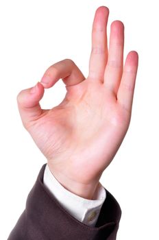 Hand in a suit making the OK sign isolated in white background