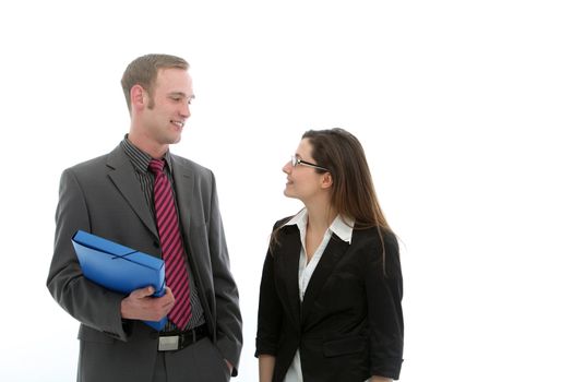 A businessman holding a blue folder in deep discussion with a female colleague, studio isolated on white