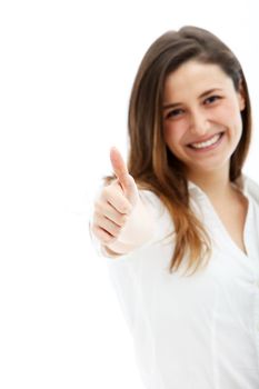 Smiling woman with her arm extended towards the camera giving a thumbs up for approval and success.