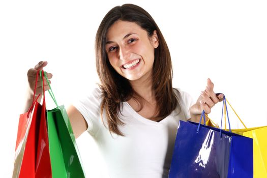 Smiling woman with colorful shopping bags on white background