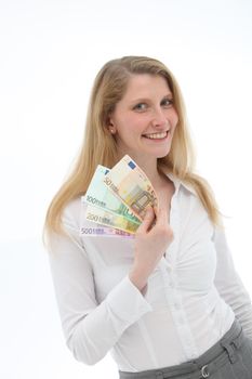 Relaxed wealthy smiling woman holding euro banknotes fanned out in her hand isolated on white