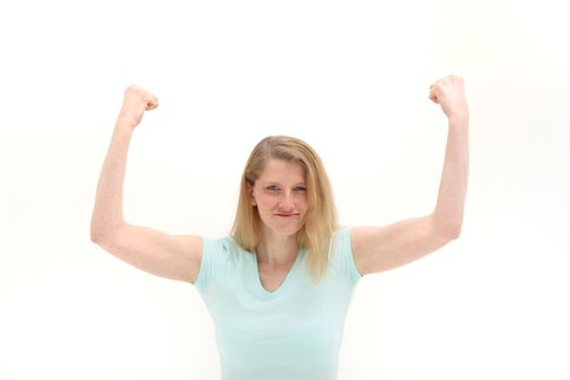 Woman shaking her raised fists in the air in frustration isolated on white