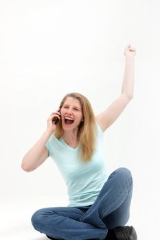 Joyful woman hears the good news over the phone