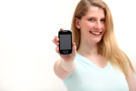 Smiling woman with smartphone on white background
