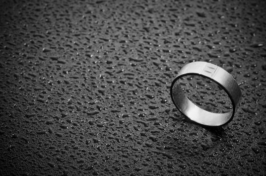 Close-up of a weeding ring on dark background