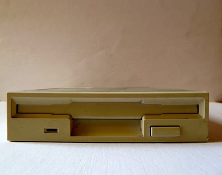 floppy drive removed from a computer on white