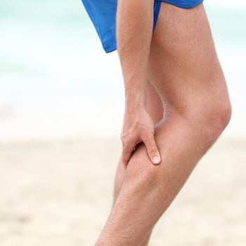 Leg calf sport muscle injury. Runner with muscle pain in leg.