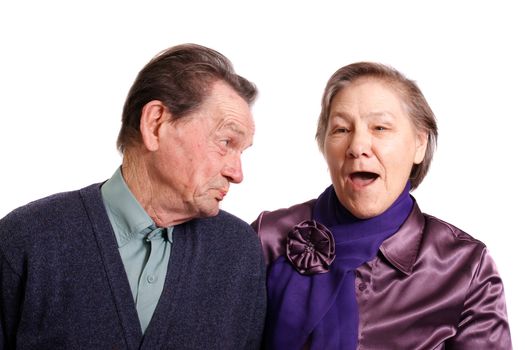 an attractive senior couple on a white background