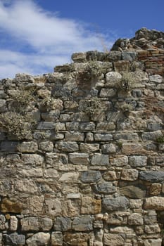 Ancient stone wall top and blue sky background