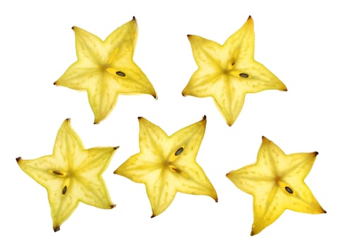 Star shaped slices of carambola fruit isolated on white background