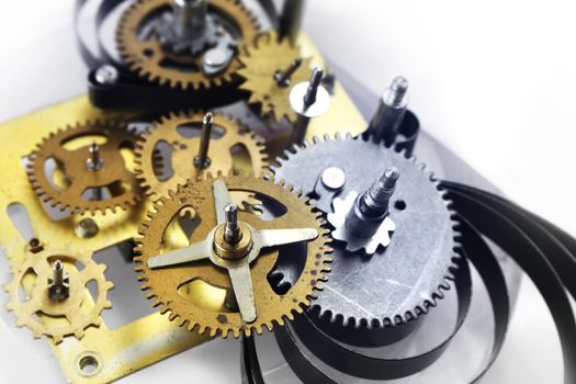 Old clockwork mechanism with brass metal gears and cogs