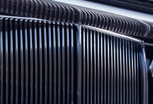 Shiny chromed front radiator grill of classic luxury car