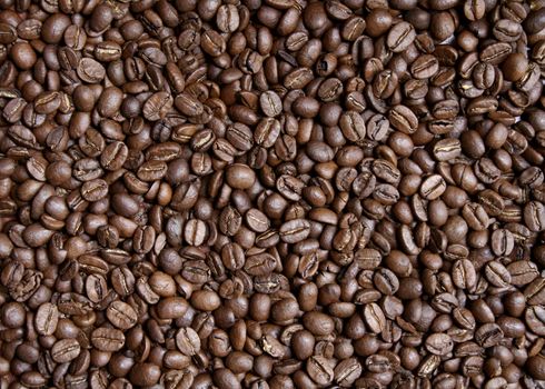 Roasted dark brown coffee beans background