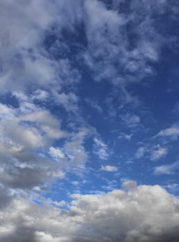 Dramatic cloudscape dark clouds gathered on blue sky background