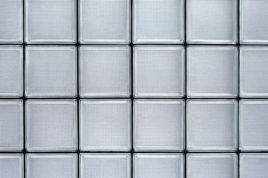 Transparent textured square glass tile wall construction