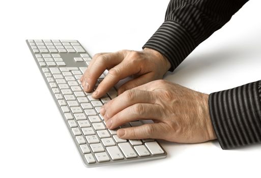 Male hands typing modern computer keyboard on white background