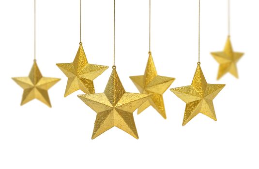 Six golden Christmas decoration stars hanging isolated on white background