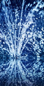 Ice cold blue water shower sparkling reflection