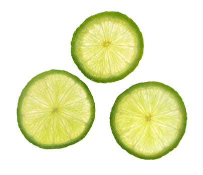 Green slices of fresh lime fruit isolated on white background