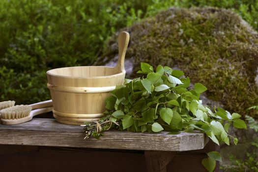 Traditional Finnish birch sauna whisk and wooden water pall