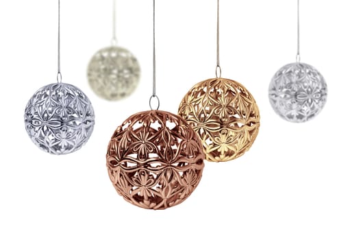 Gold copper silver Christmas balls hanging on white background