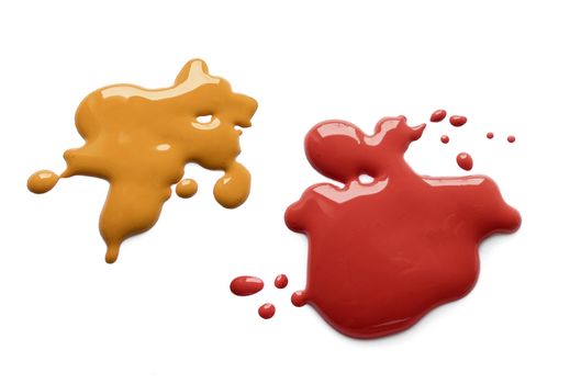 Yellow mustard and dark red ketchup splatter on white background