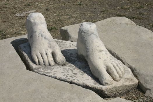 Stone feet remaining from an ancient statue base