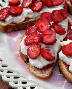 Delicious pastries with fresh strawberries and whipped cream