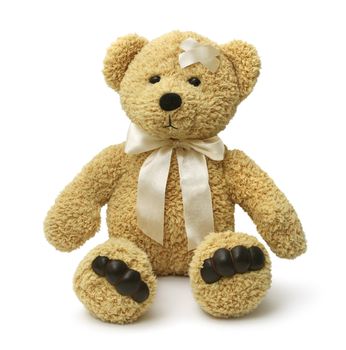 Injured teddy bear sitting sad on white background isolated
