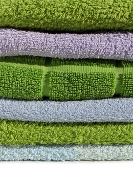 Colorful pile of soft clean terry cloth towels sharp details