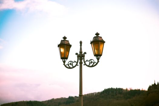 old style lantern over colorful sky